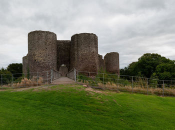 Castle on field against sky