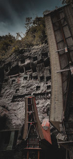 Low angle view of abandoned building against sky