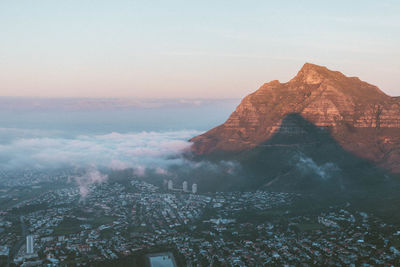 Aerial view of city with mountain peak