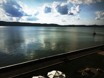 Scenic view of sea against cloudy sky