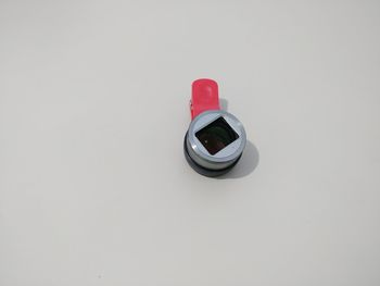 High angle view of camera on white background