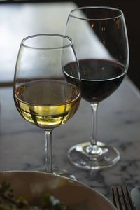 Close-up of wine glasses on table