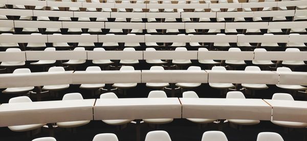 Full frame shot of empty chairs in auditorium