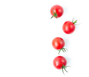 Close-up of cherry tomatoes against white background