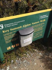 High angle view of information sign on field