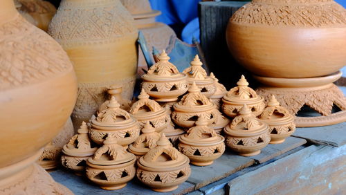 Close-up of various pots at market stall