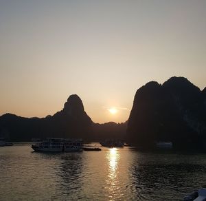 Scenic view of sea against clear sky during sunset