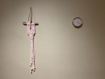 Low angle view of clock mounted on wall