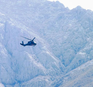 Person skiing on snowcapped mountain