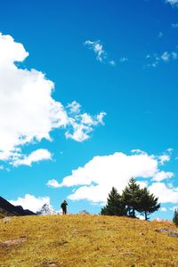 Scenic view of landscape against cloudy sky