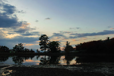 Scenic view of lake against sky during sunset