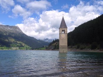 Scenic view of lake and mountains against sky