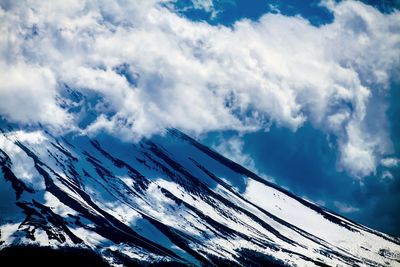 Low angle view of snow against sky