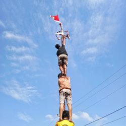 Low angle view of statue against sky