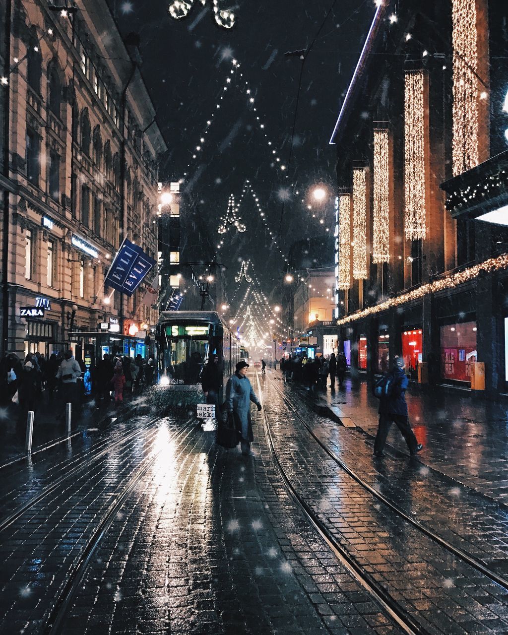 WET ILLUMINATED CITY DURING RAINY SEASON