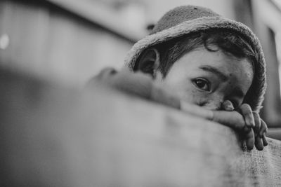 Close-up portrait of boy wearing hooded jacket