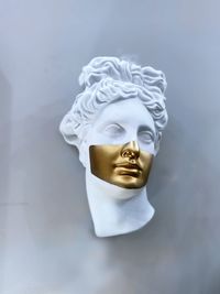 Close-up of statue against white background