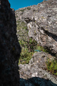 Low angle view of rock against sky