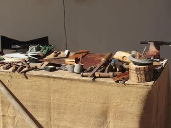 Clothes drying on table against wall