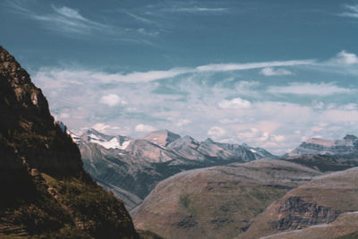 Scenic view of mountains against cloudy sky