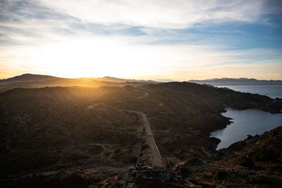 Scenic view of landscape against sky during sunset