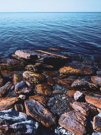 Aerial view of sea against clear sky