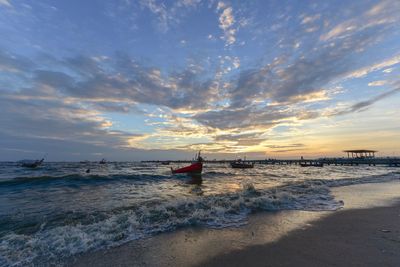 Scenic view of beach against sky during sunset