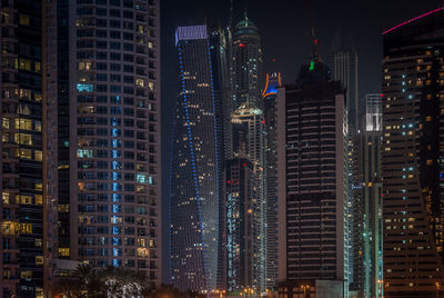 View of skyscrapers lit up at night
