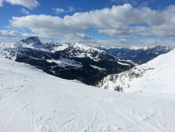 Scenic view of snowcapped mountains against sky