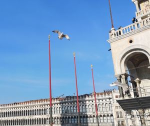 Low angle view of buildings against blue sky