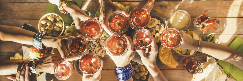 Women toasting glasses of drinks in restaurant