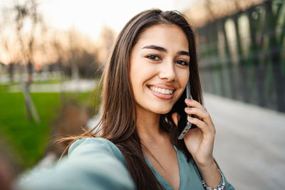 Young woman using mobile phone