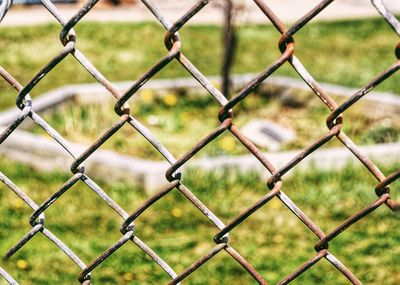 Full frame shot of chainlink fence against sky