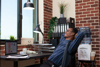 Businessman relaxing at office