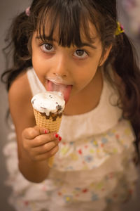 Close-up of young woman holding ice cream