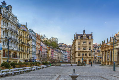 Buildings in city against sky