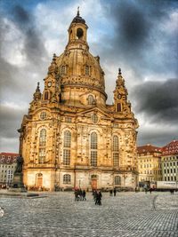 Low angle view of cathedral against cloudy sky