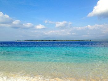 Scenic view of sea against cloudy sky