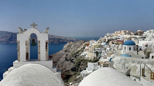 Town by sea against clear sky at santorini