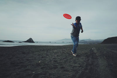 Woman jumping on beach