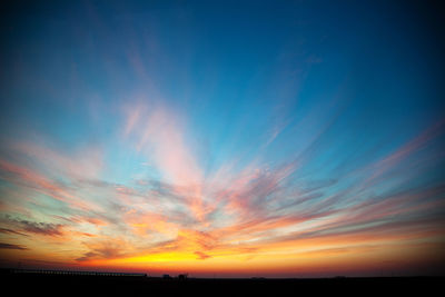 Scenic view of silhouette landscape against sky at sunset