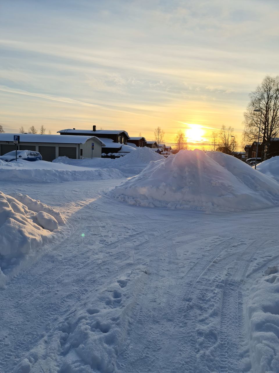 SNOW COVERED LAND DURING SUNSET