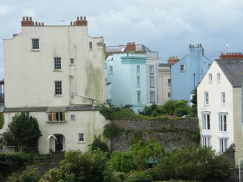 Houses against sky in city