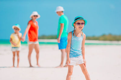 Rear view of people at beach