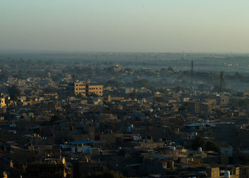 High angle view of buildings in city against sky