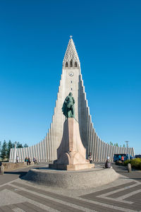 Statue of temple against blue sky