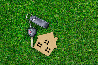 High angle view of arrow symbol on grass