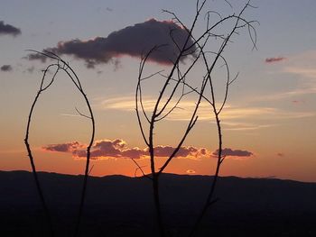 Silhouette of landscape against sunset sky