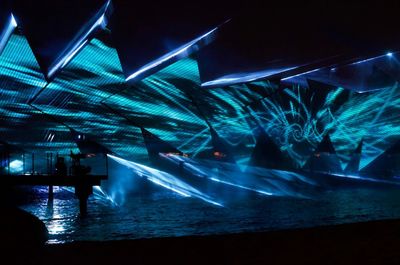 People enjoying illuminated at night
