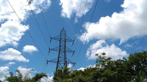 Low angle view of electricity pylon against sky